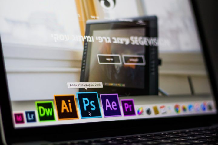 turned-on-laptop-on-desktop-with-hovered-adobe-photoshop-cc-693892